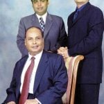 Kokilaben Ambani's husband Dhirubhai Ambani (sitting) with their sons Mukesh Ambani (left) and Anil Ambani (right)