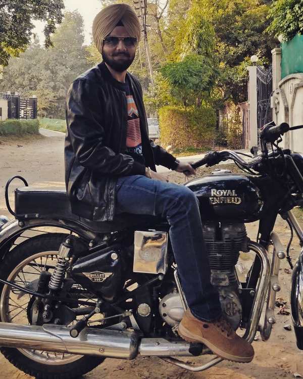 Jaspreet Singh sitting on his bike